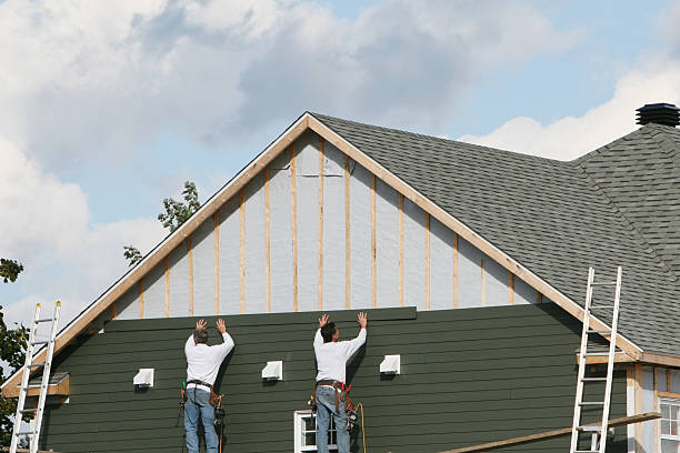 Professional Siding Replacement technician working in Plainview, NY